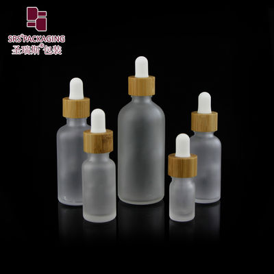 comprar Custom Frosted Essential Oil Empty Packaging 15ml 30ml 50ml 100ml Bamboo Dropper Bottle Fabricación en línea